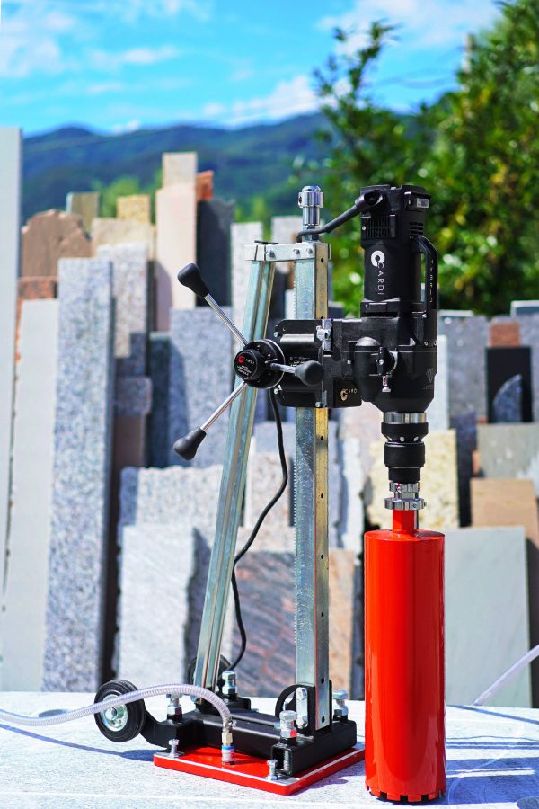 CARDI HS 300 core drill with core bit and stand on marble.