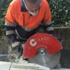 Construction worker cut a concrete block using CARDI PE 401 diamond blade saw.